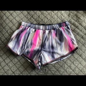 Women’s lululemon shorts, size 8. Multicolored pink, purple, dark gray trim.